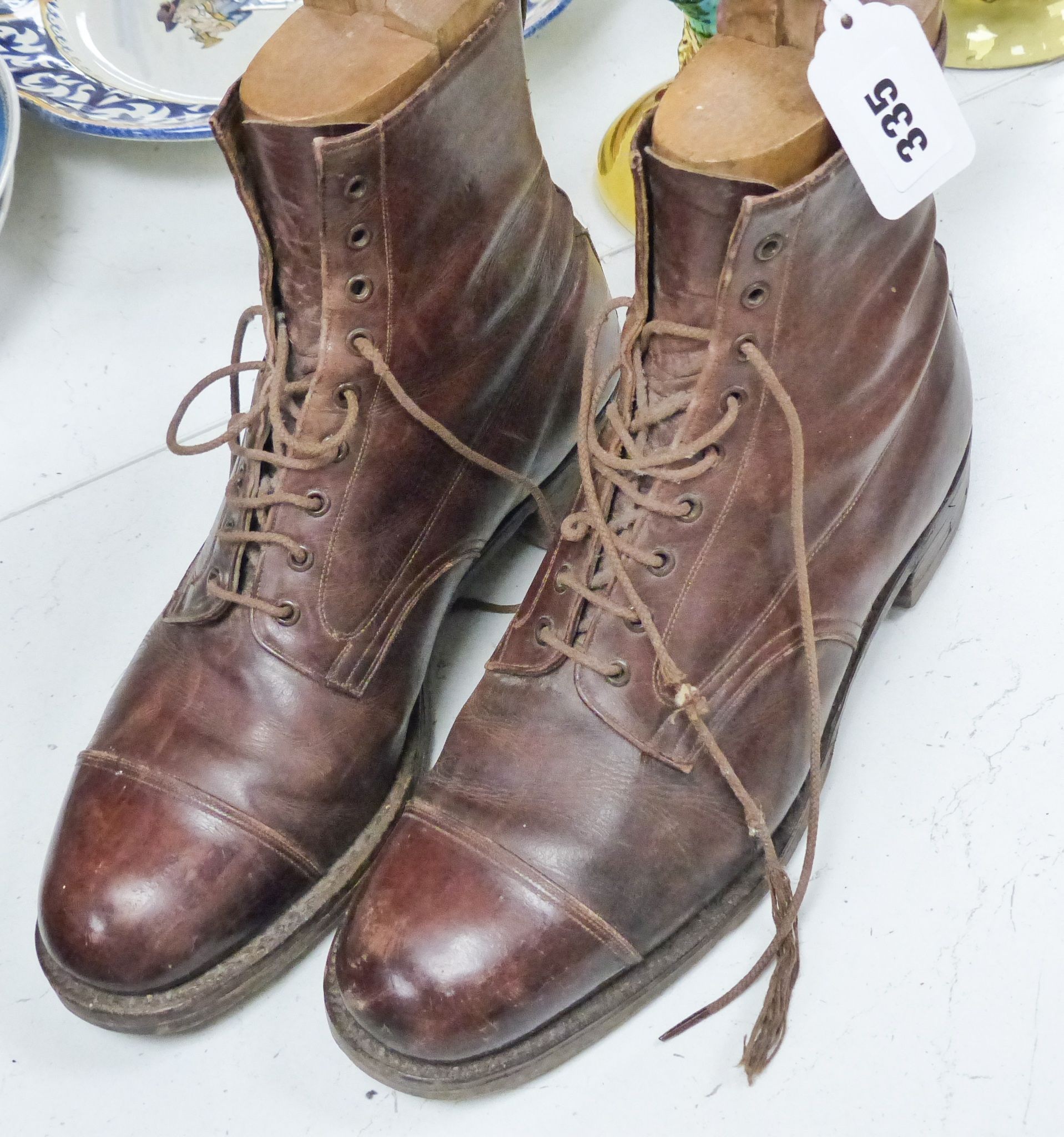 A pair of tan leather boots with trees